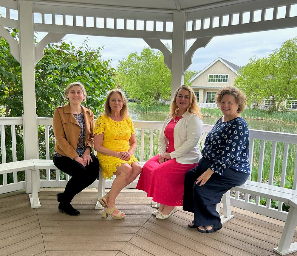 women sitting down in pagoda