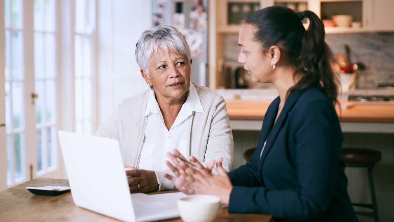 two woman on a laptop