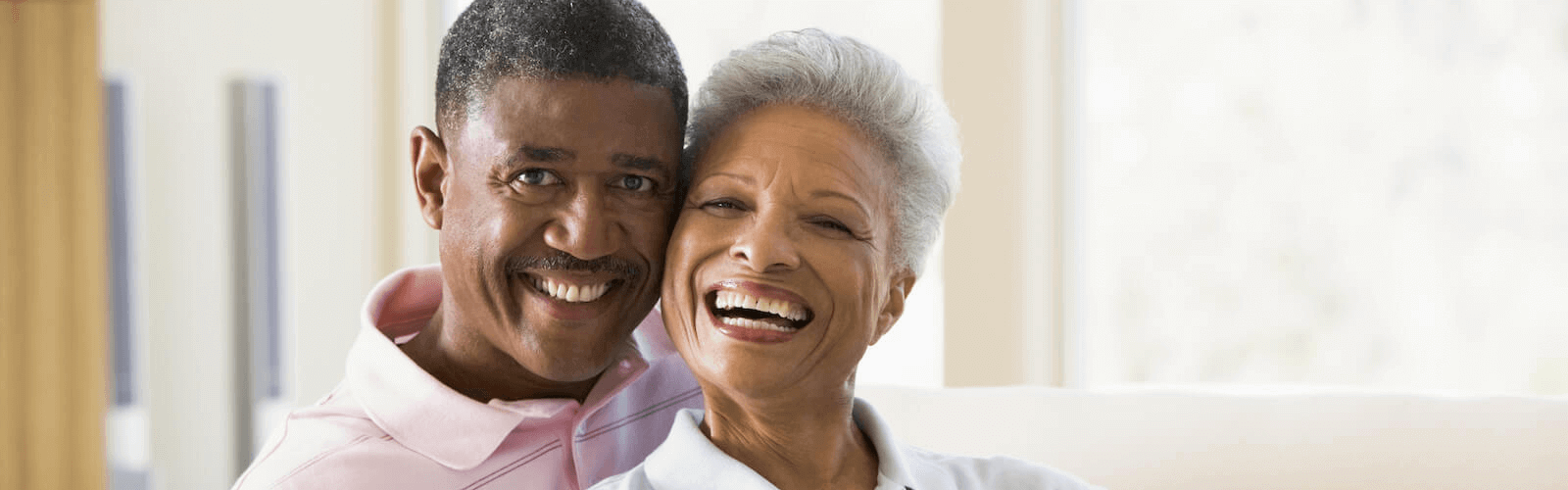 senior couple relaxing on couch