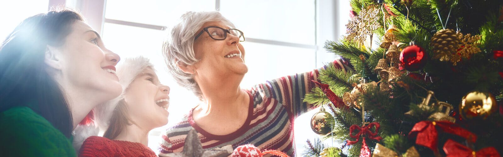 helping grandma decorate the tree