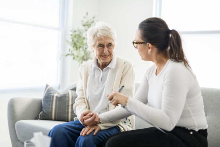 A old woman thinking with psychologist in consultation office for mind, evaluation or assessment.
